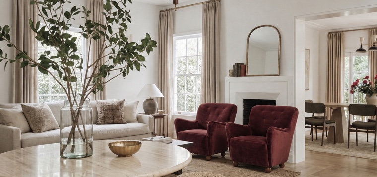 Bright living room with burgundy velvet chairs